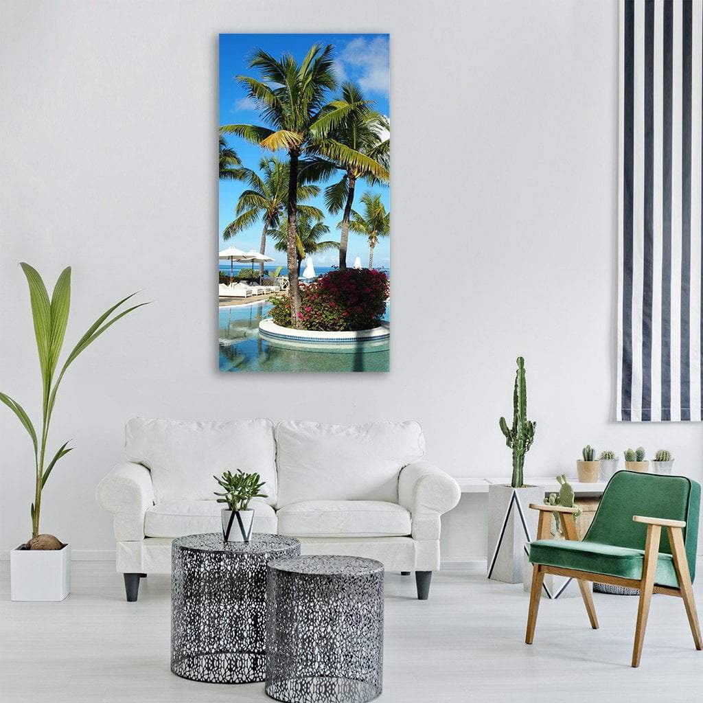 Mauritius Swimming Pool Vertical Canvas Wall Art in green and blue, single vertical panel hung on a wall