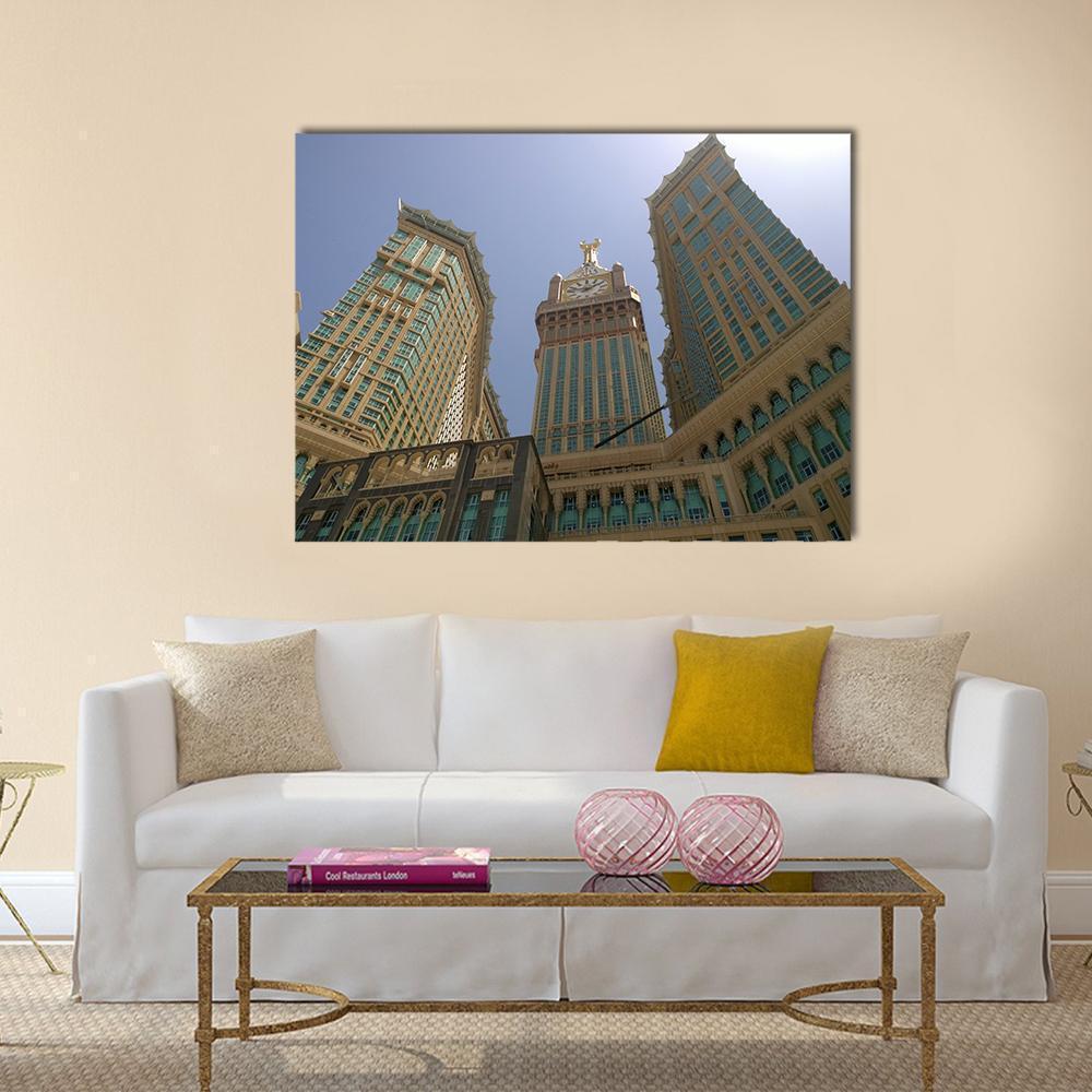 Mecca Royal Clock Tower Canvas Wall Art in beige, gold and blue, single panel hung on a wall