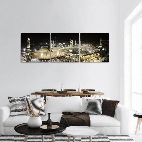 Masjid Al-haram Night View of the Kaaba Panoramic Canvas Wall Art in black, white and gold, hung on a wall