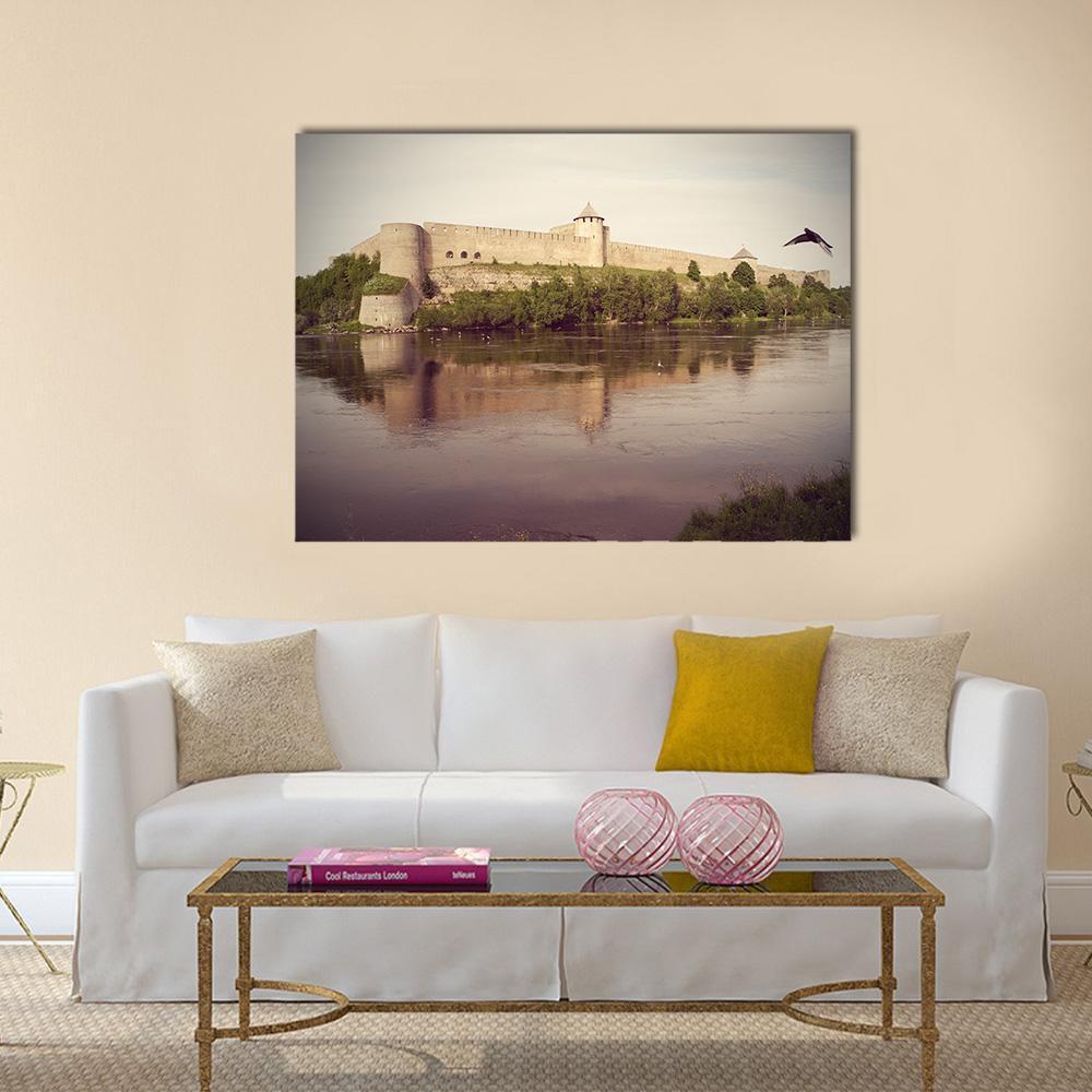 Stone Fortress with River Reflection Canvas Wall Art in gray, beige and brown, single panel hung on a wall