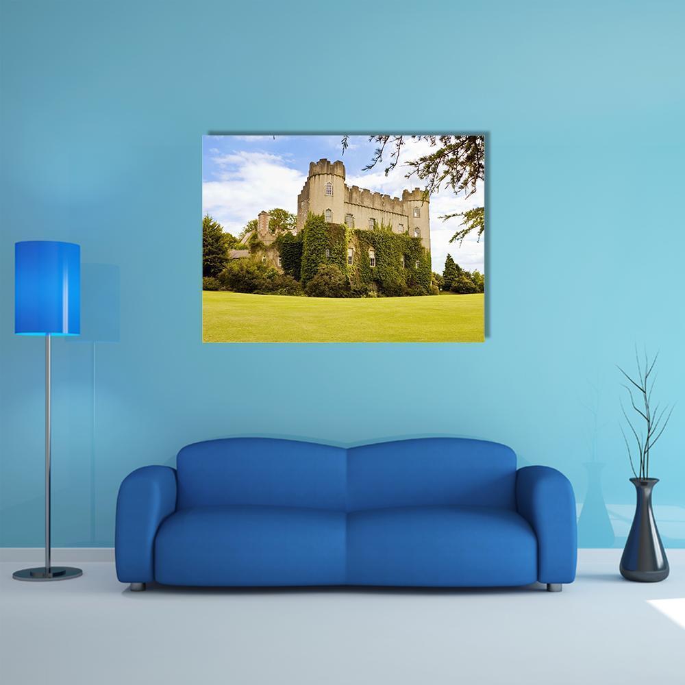 Medieval Irish Castle Canvas Wall Art in yellow, green and blue, single panel hung on a wall