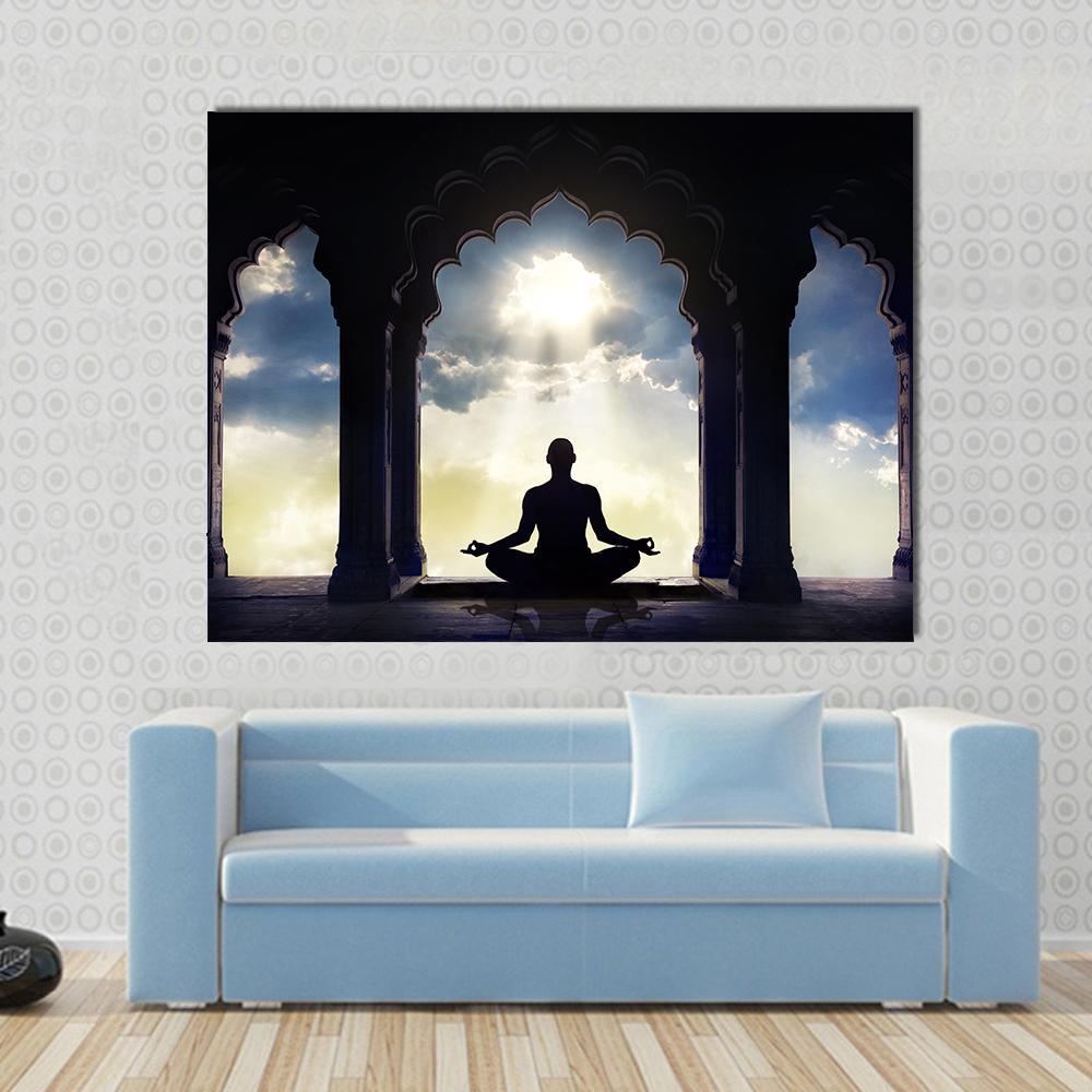 Meditating in Old Temple Canvas Wall Art in black, yellow and blue, single panel hung on a wall