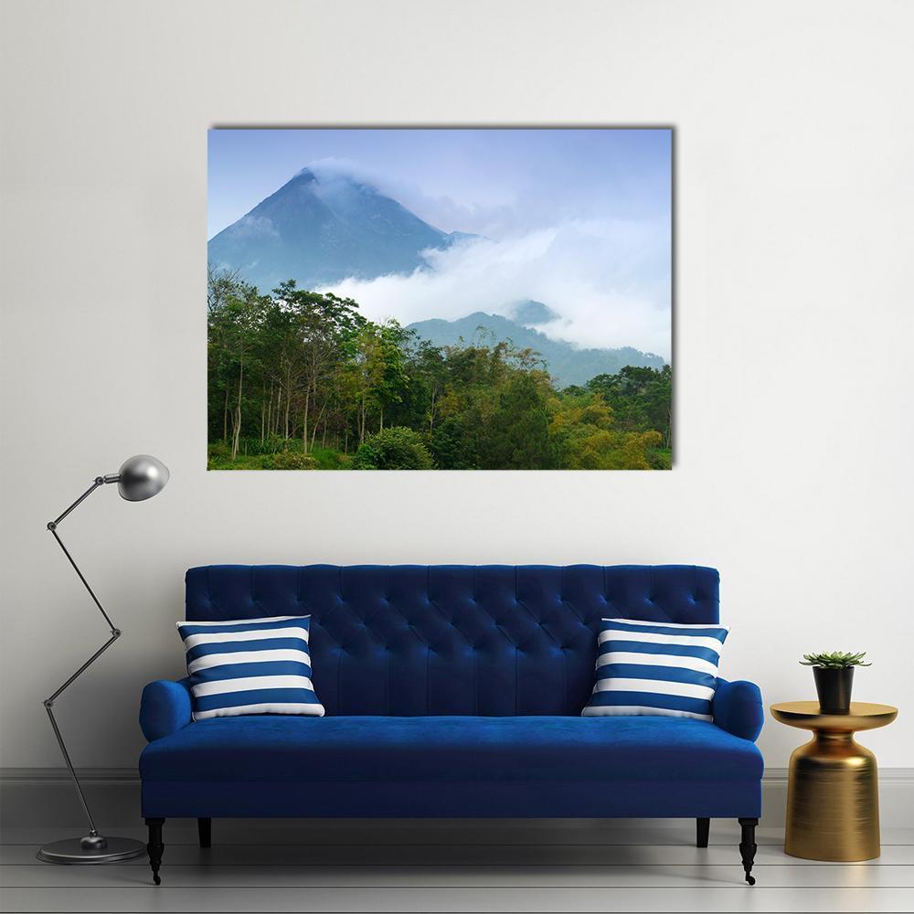 Mount Merapi with Smoke and Mist Canvas Wall Art in white, green and blue, single panel hung on a wall