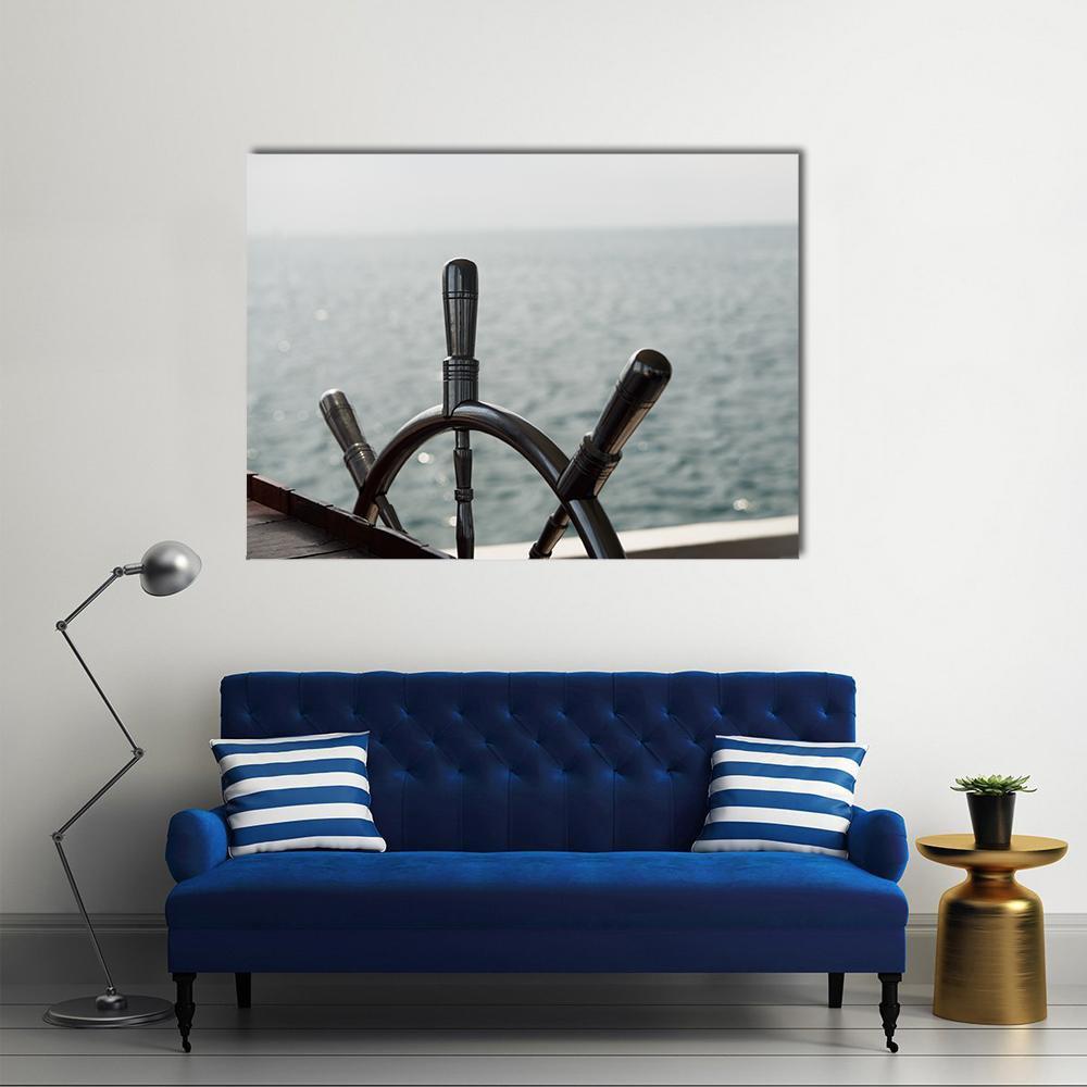 Wooden Ship Wheel Close-up Canvas Wall Art in black, gray and brown, single panel hung on a wall