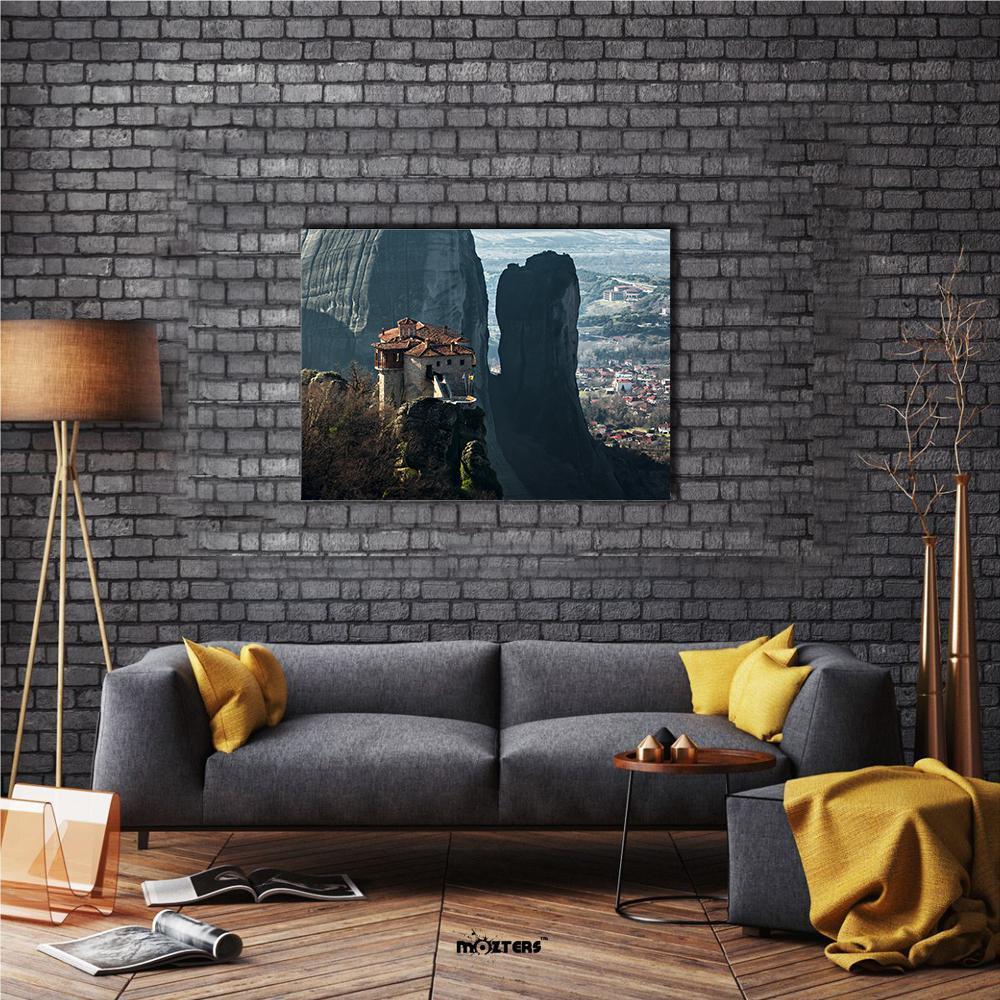 Monastery on Rock Pinnacle Canvas Wall Art in gray, brown and blue, single panel hung on a wall
