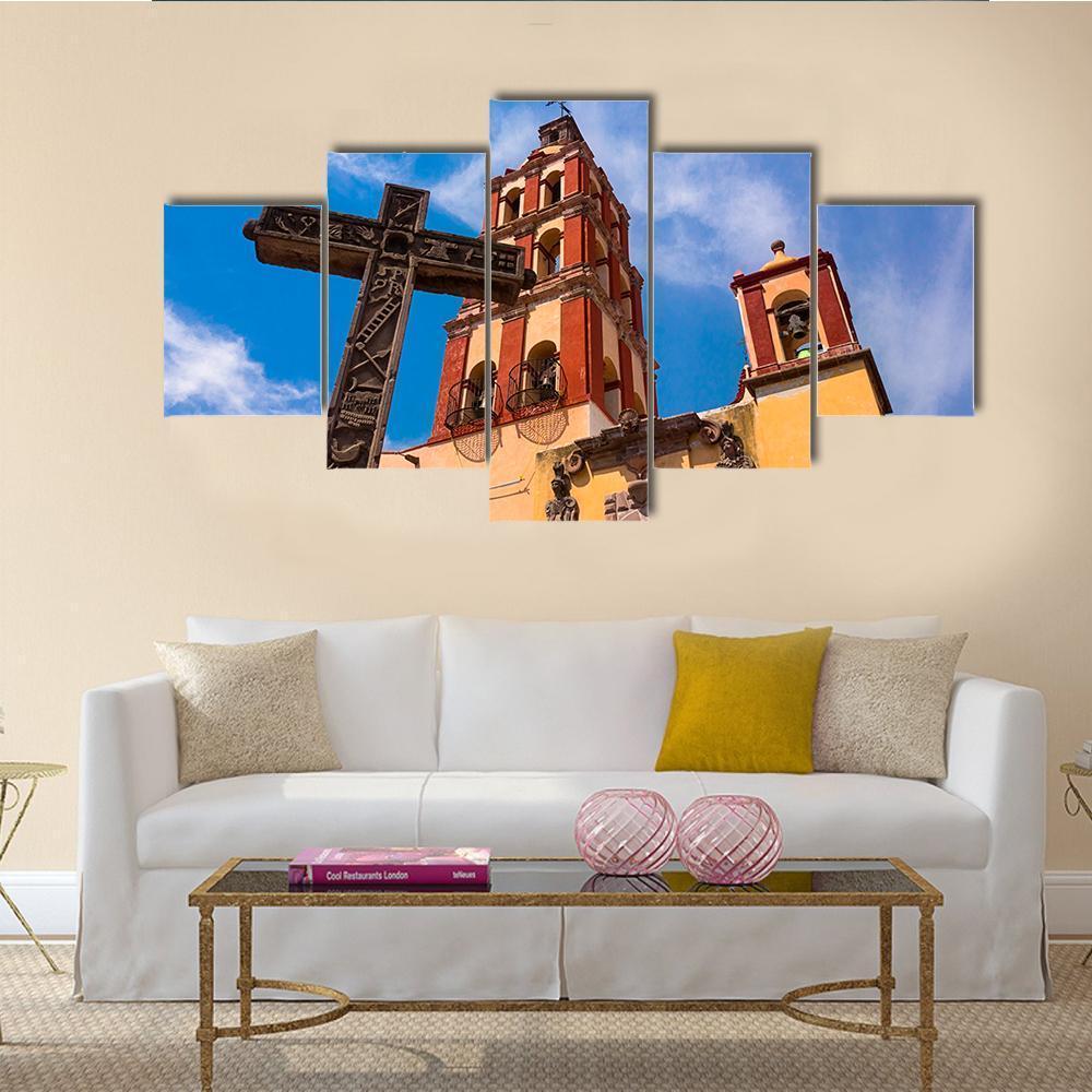 Colonial Church with Bell Tower Canvas Wall Art in orange, yellow and blue, 5 panel Star layout hung on a wall
