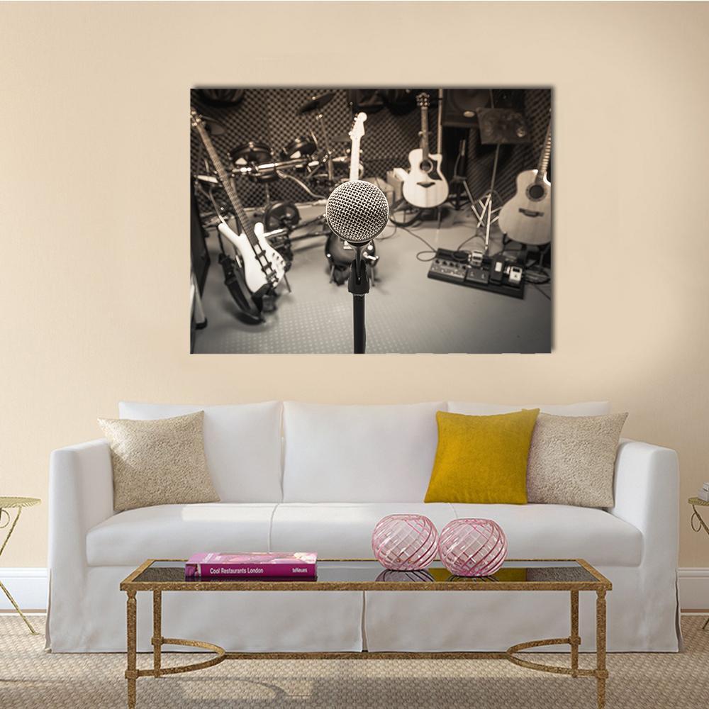 Vintage Studio Microphone with Guitars and Drums Canvas Wall Art in black, white and gray, single panel hung on a wall