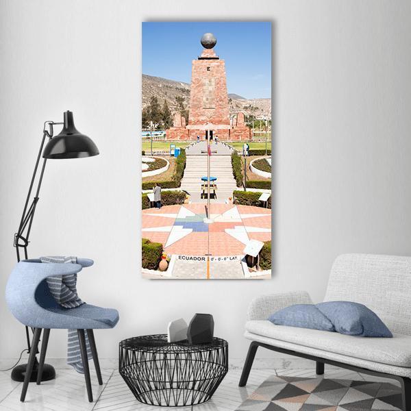 Mitad Del Mundo Monument, Ecuador Vertical Canvas Wall Art in beige, brown and blue, single vertical panel hung on a wall