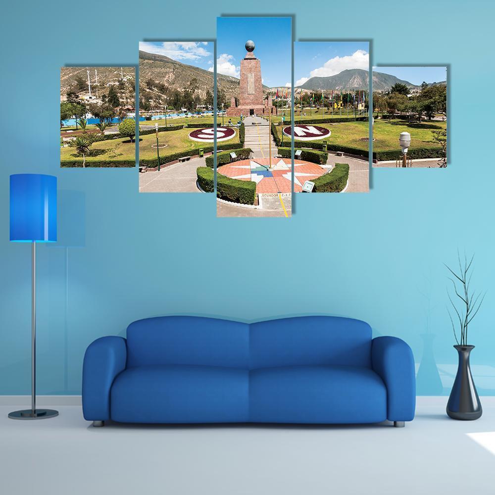 Middle of the World Monument Canvas Wall Art in gray, green and blue, 5 panel Star layout hung on a wall