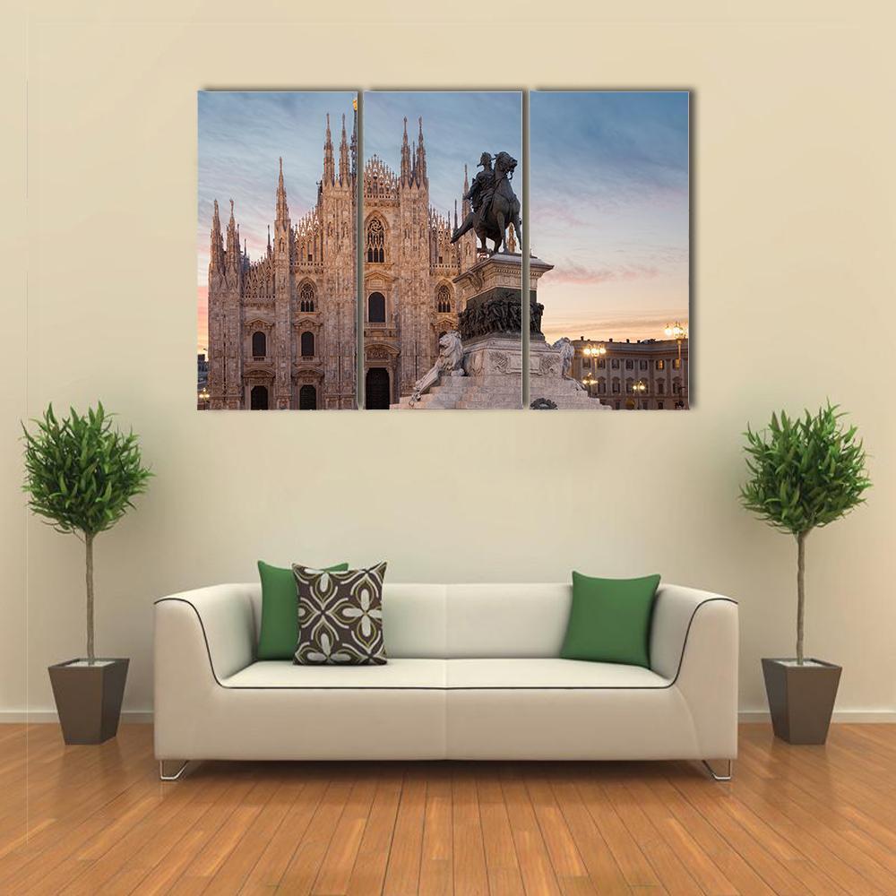 Gothic Cathedral and Equestrian Statue at Dusk Canvas Wall Art in gray, beige and blue, 3 panel horizontal set hung on a wall