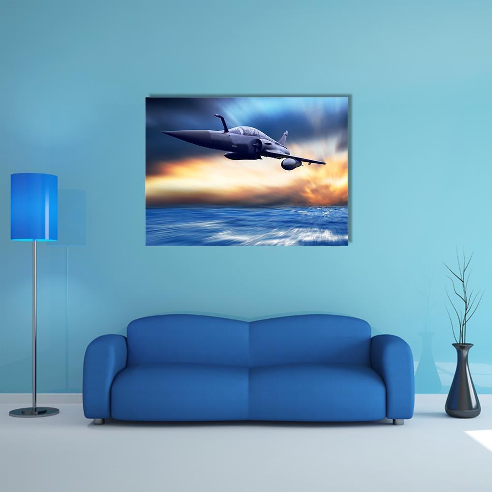 Military Fighter Jet Over Stormy Ocean Canvas Wall Art in black, orange and blue, single panel hung on a wall