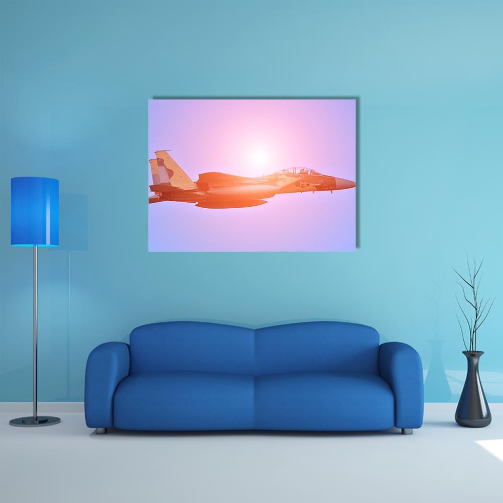 Military Fighter Jet at Sunset Canvas Wall Art in orange, purple and pink, single panel hung on a wall