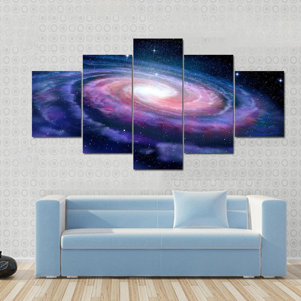 Milky Way Galaxy Canvas Wall Art in black, blue and purple, 5 panel Star layout hung on a wall