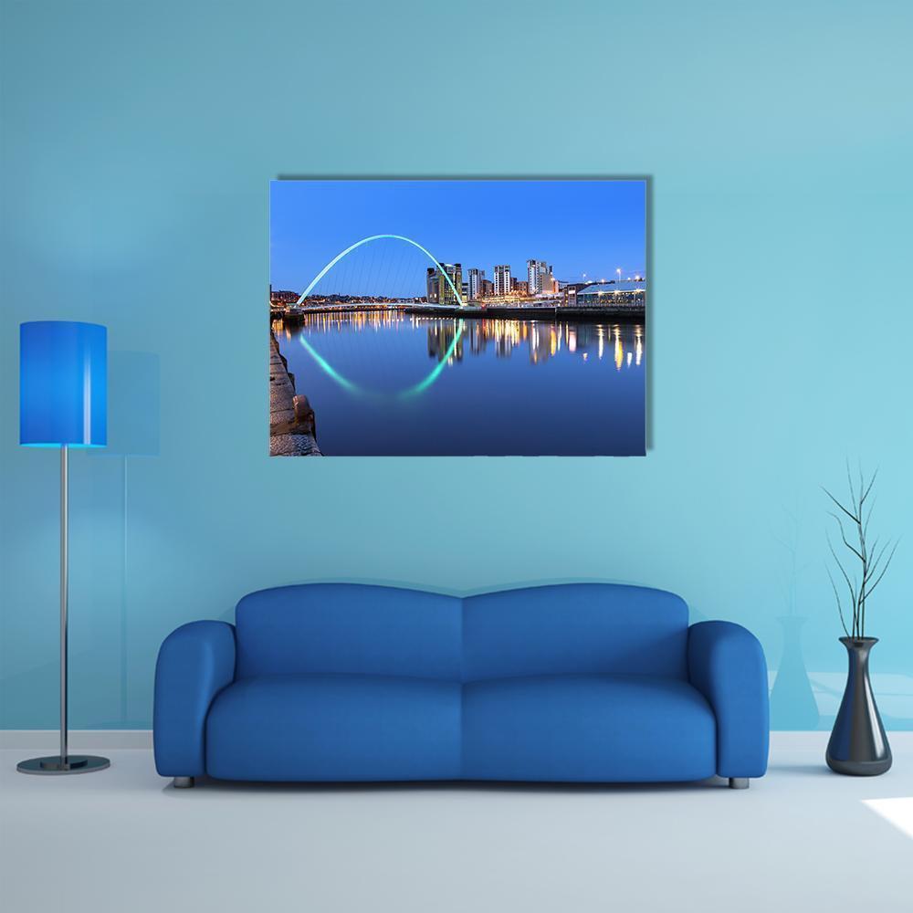 Millennium Bridge Night Reflection Canvas Wall Art in black and blue, single panel hung on a wall