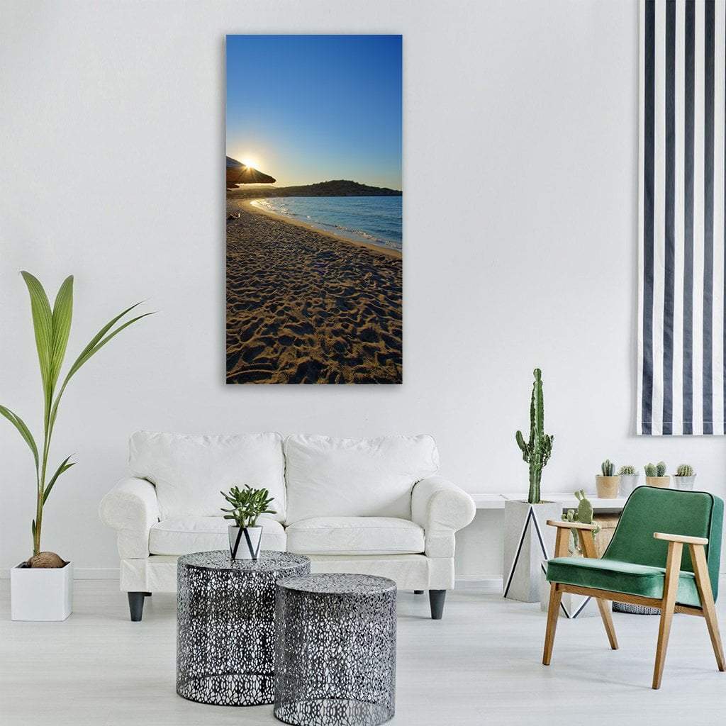 Milos Island Sandy Shoreline Vertical Canvas Wall Art in beige, brown and blue, single vertical panel hung on a wall