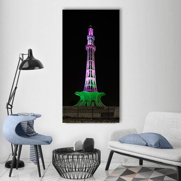 Minar-e-pakistan at Night Vertical Canvas Wall Art in black, green and purple, single vertical panel hung on a wall
