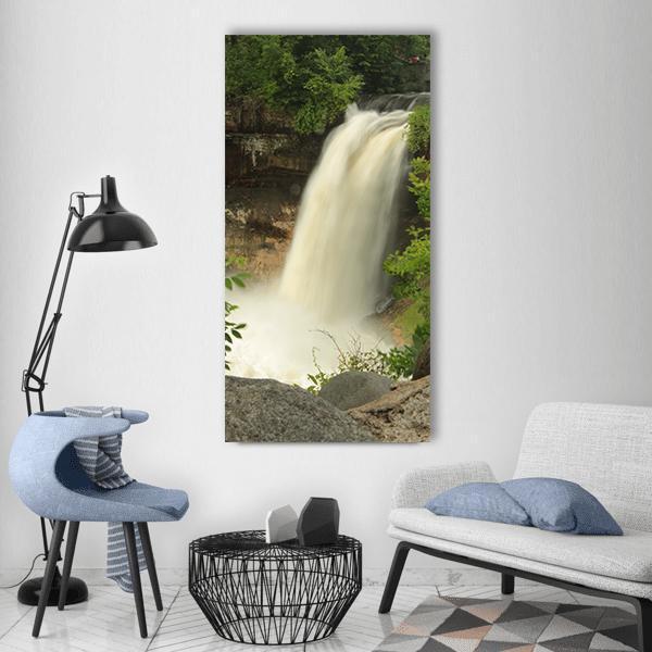 Minnehaha Falls Waterfall Vertical Canvas Wall Art in white, brown and green, single vertical panel hung on a wall
