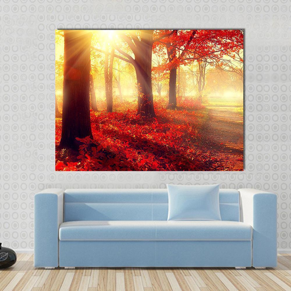 Scenic Autumn Forest Canvas Wall Art in red, orange and yellow, single panel hung on a wall