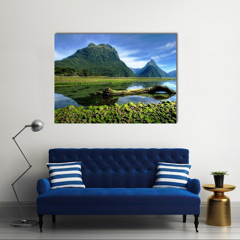 Mitre Peak New Zealand Lake Scene Canvas Wall Art in green and blue, single panel hung on a wall