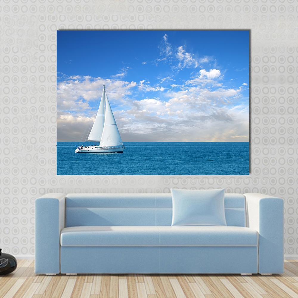 Modern Sail Boat Canvas Wall Art in white and blue, single panel hung on a wall