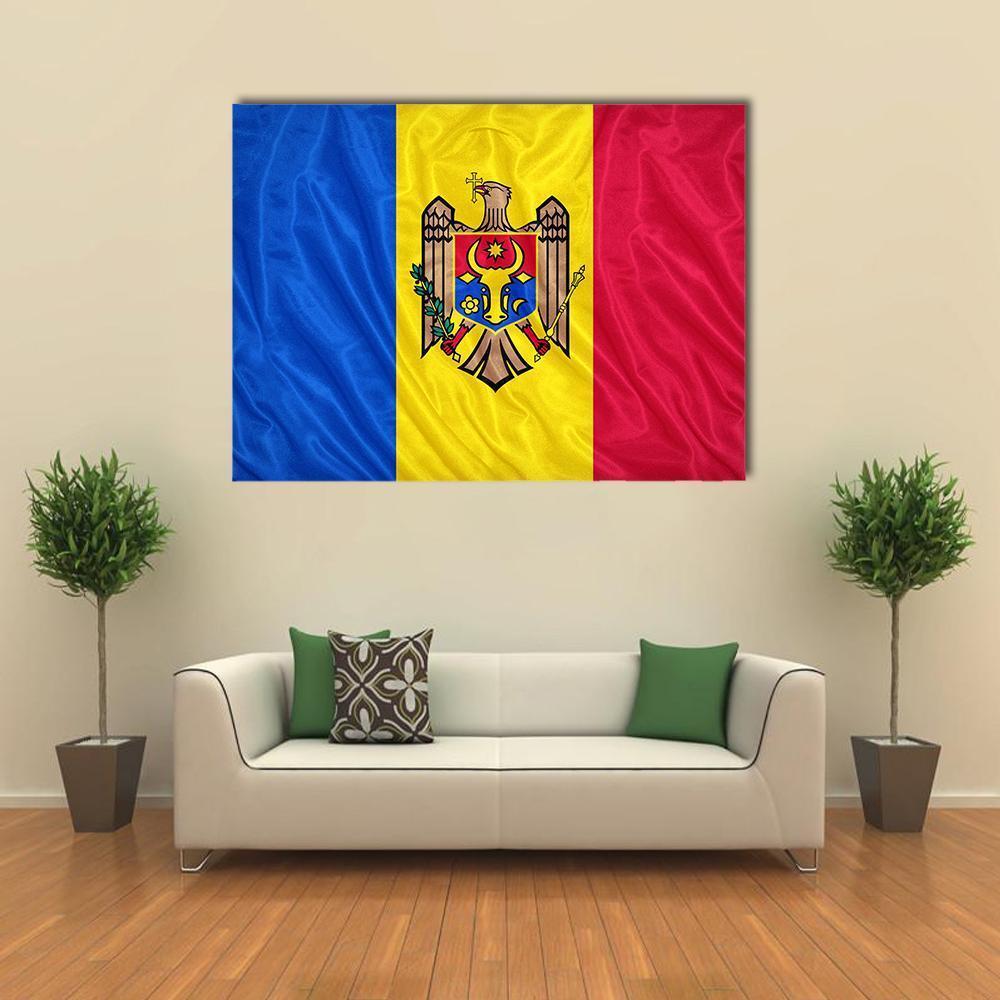 Waving Moldovan Flag Canvas Wall Art in red, yellow and blue, single panel hung on a wall
