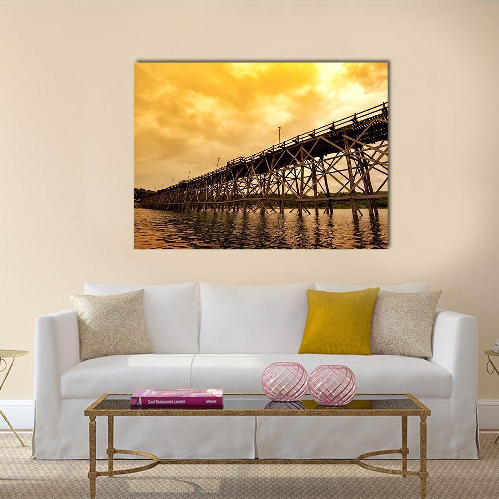Mon Bridge at Dawn Canvas Wall Art in brown, gold and yellow, single panel hung on a wall