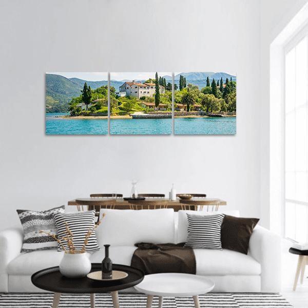 Monastery of St Michael by the Sea Panoramic Canvas Wall Art in white, green and blue, hung on a wall
