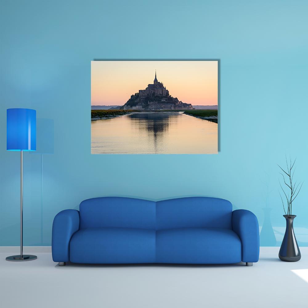 Mont Saint-michel at Sunset Canvas Wall Art in orange, yellow and blue, single panel hung on a wall