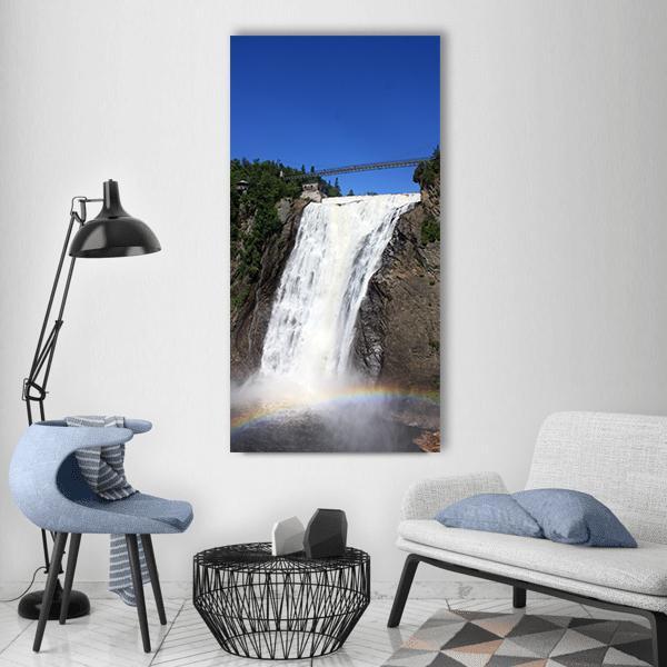 Suspension Bridge Above Rainbow Waterfall Vertical Canvas Wall Art in white, brown and blue, single vertical panel hung on a wall