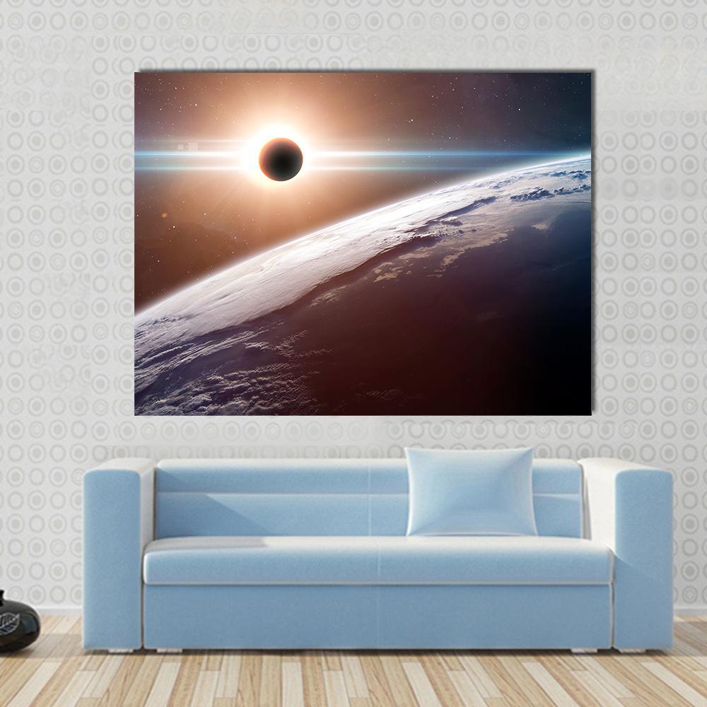 Moon Blocking Sunlight on Planet Earth Canvas Wall Art in black, orange and blue, single panel hung on a wall