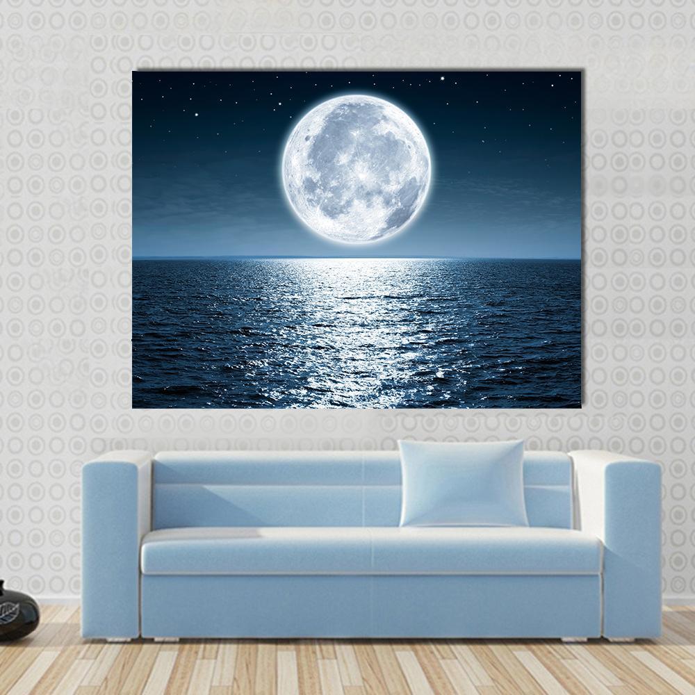 Ocean Moonlight Reflection Canvas Wall Art in white, blue and navy, single panel hung on a wall