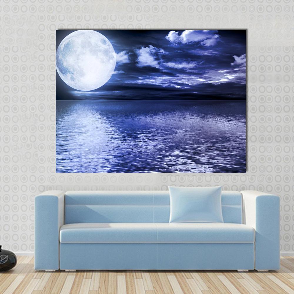 Moon Reflection in Water Canvas Wall Art in black, white and blue, single panel hung on a wall