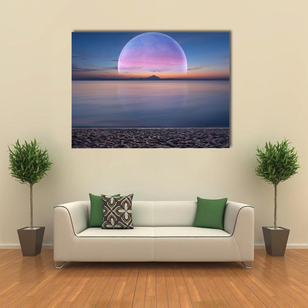 Giant Planet Moonrise Over Pebbly Beach Canvas Wall Art in orange, blue and purple, single panel hung on a wall