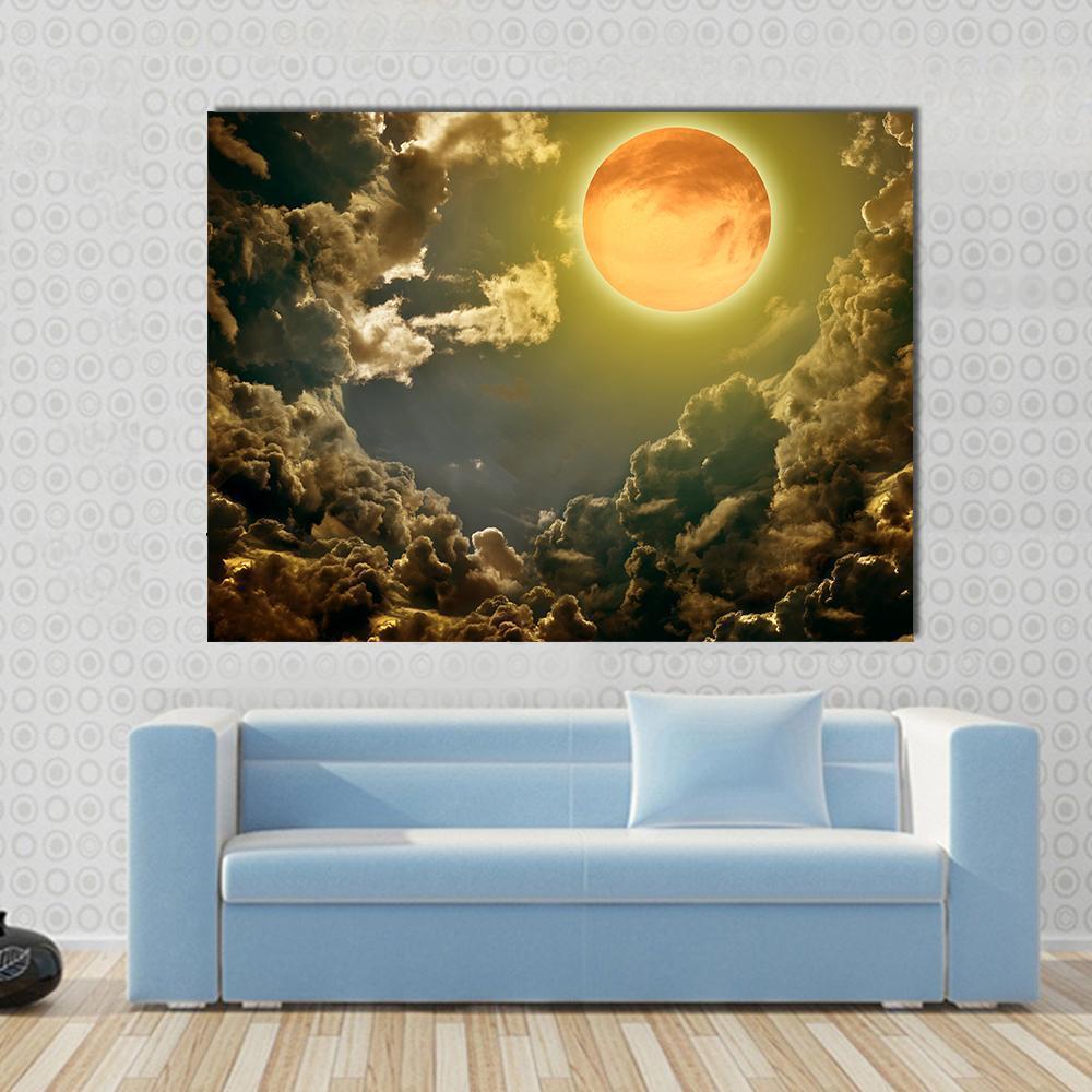 Moon in Dark Clouds Canvas Wall Art in black, gold and yellow, single panel hung on a wall