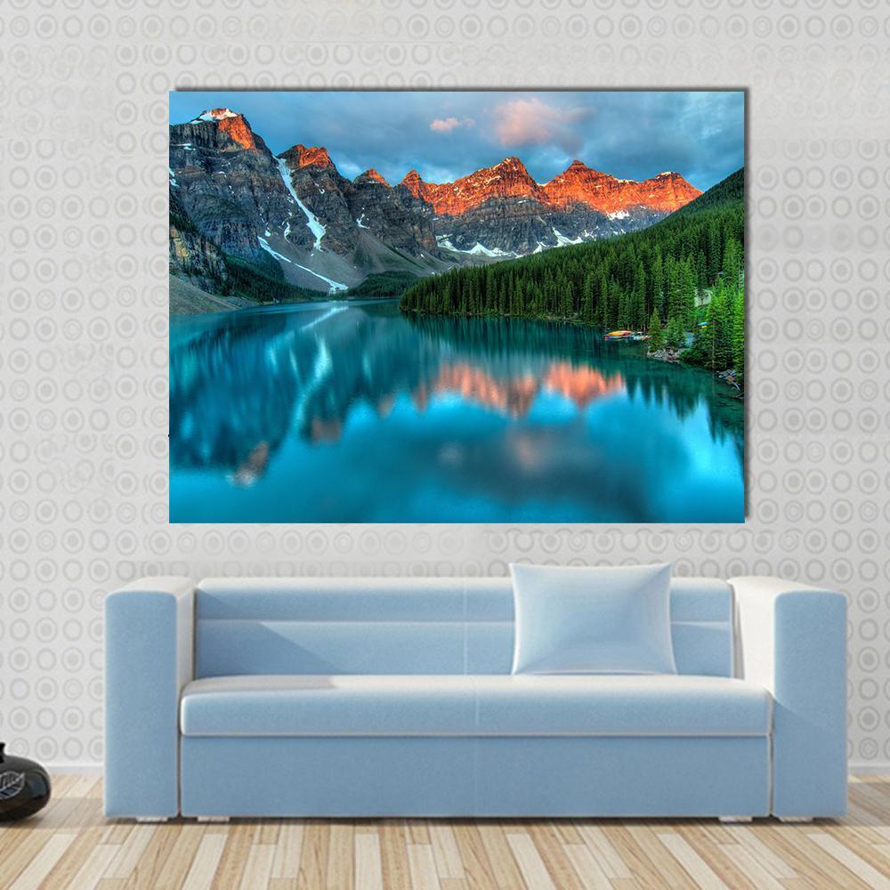 Moraine Lake Sunrise Canvas Wall Art in brown, orange and blue, single panel hung on a wall