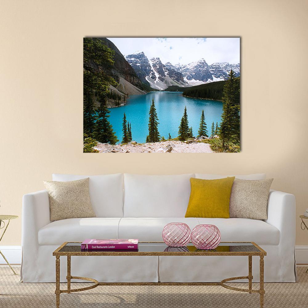 Moraine Lake Turquoise Mountain Landscape Canvas Wall Art in gray, green and blue, single panel hung on a wall