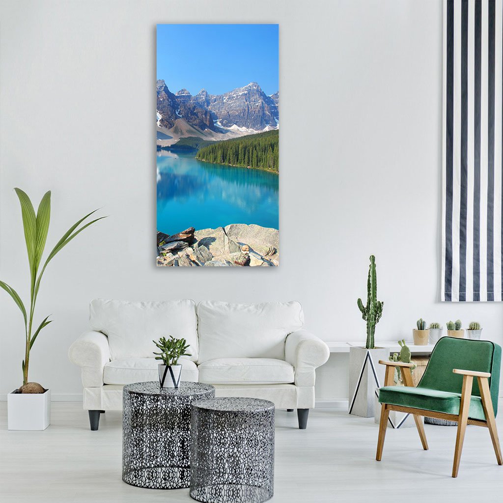 Moraine Lake in the Canadian Rockies Vertical Canvas Wall Art in gray, green and blue, single vertical panel hung on a wall