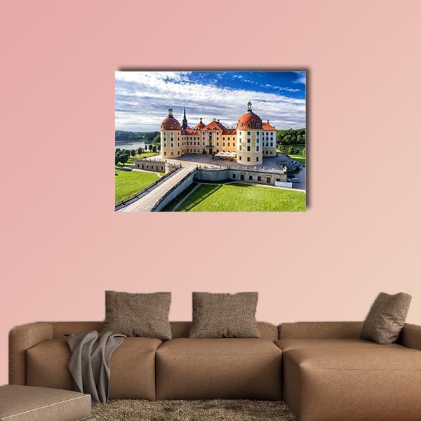 Moritzburg Castle in Saxony with Bridge Canvas Wall Art in beige, green and blue, single panel hung on a wall