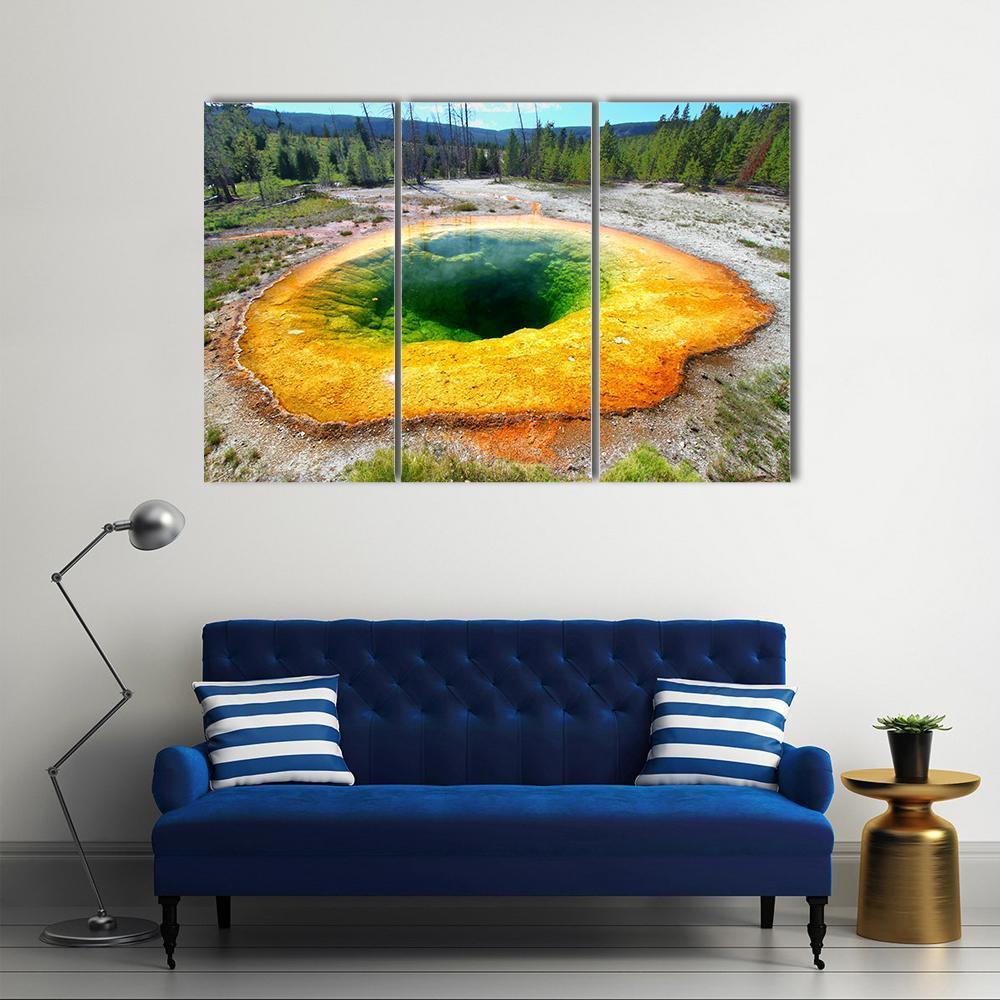 Morning Glory Pool, Yellowstone Canvas Wall Art in orange, yellow and green, 3 panel horizontal set hung on a wall