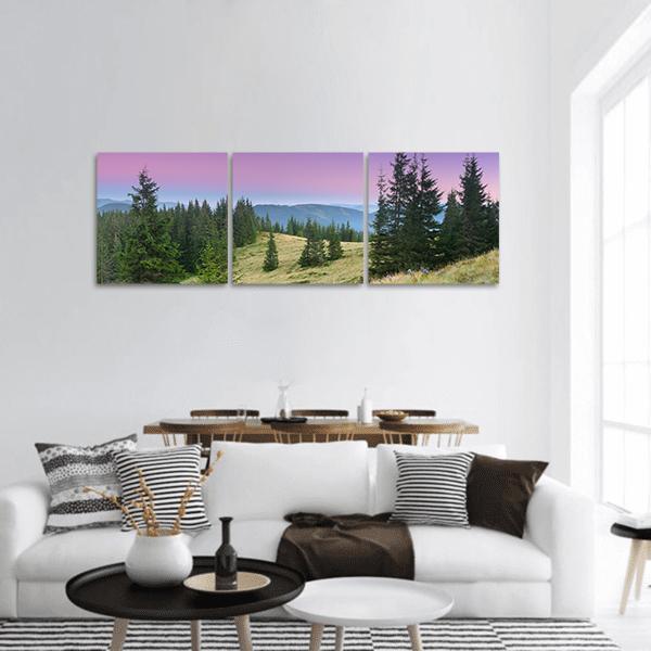 Mountain Morning Landscape Panoramic Canvas Wall Art in green, purple and pink, hung on a wall