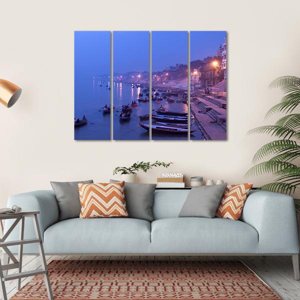 Morning Rowboats Along Misty Ghats Canvas Wall Art in blue and purple, hung on a wall