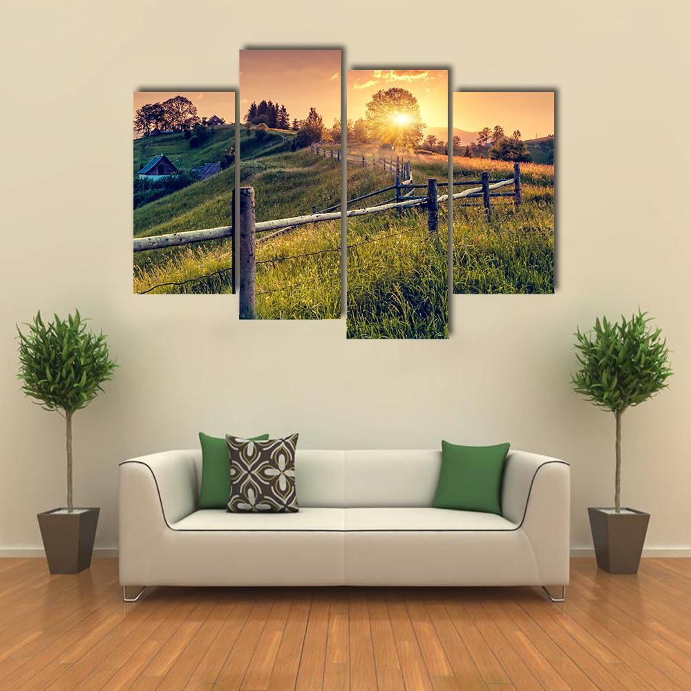 Sunset Farmhouse with Wooden Fence Canvas Wall Art in orange, yellow and green, 5 panel Pop layout hung on a wall