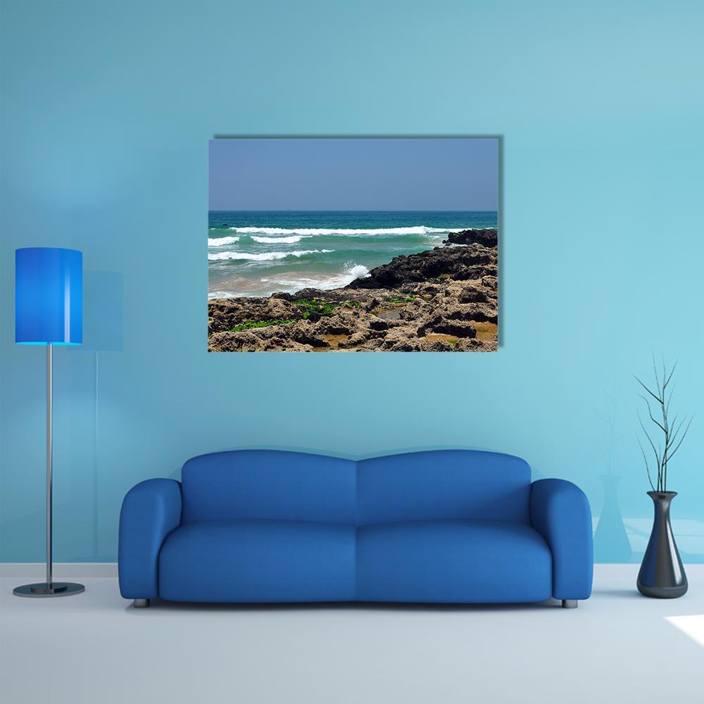Taghazout Bay Rocky Shore Seascape Canvas Wall Art in white, brown and blue, single panel hung on a wall