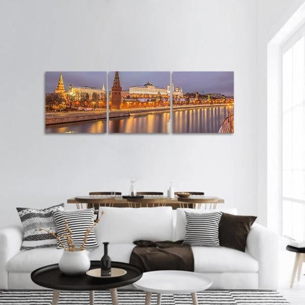 Moscow Kremlin at Sunrise Panoramic Canvas Wall Art in gold, yellow and purple, hung on a wall