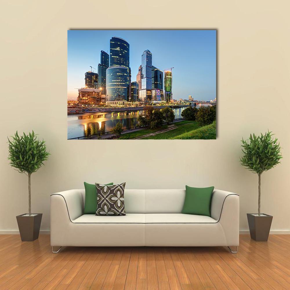 Moscow Business Center at Dusk Canvas Wall Art in orange, green and blue, single panel hung on a wall