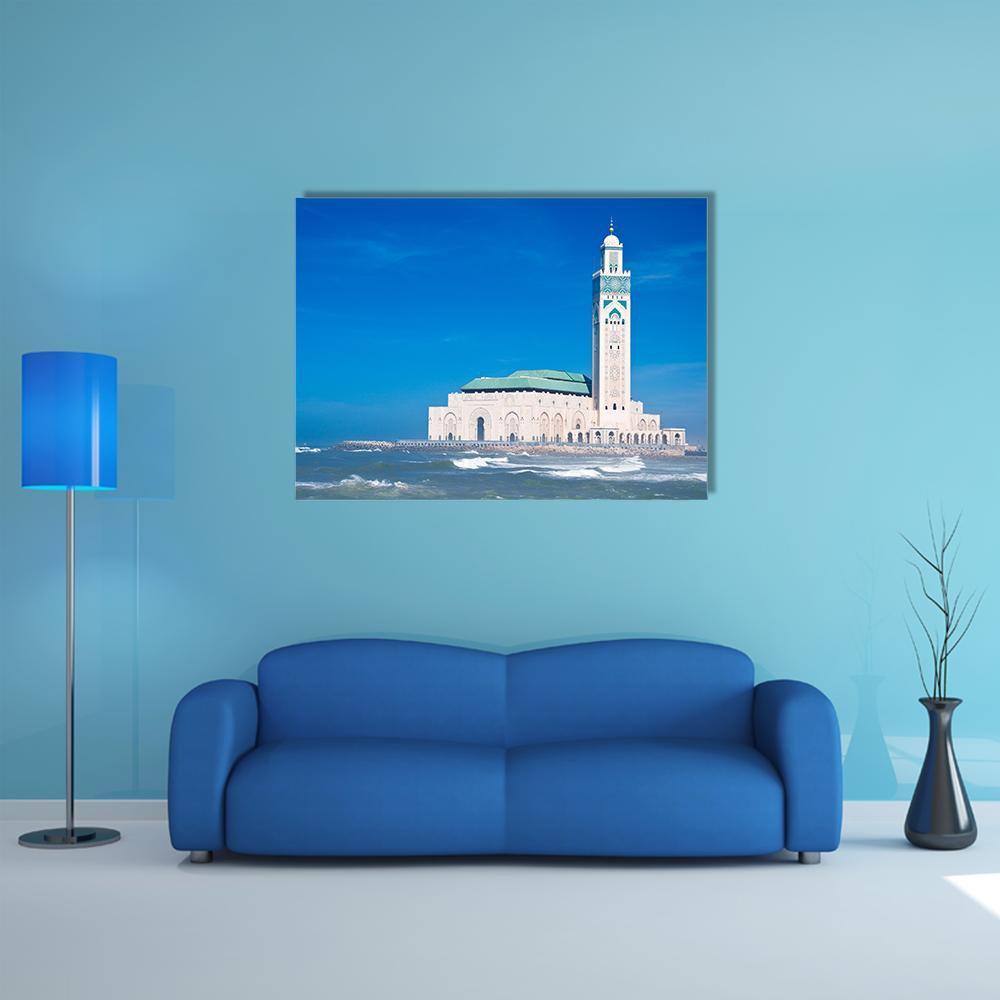Hassan Ii Mosque with Crashing Waves Canvas Wall Art in white and blue, single panel hung on a wall