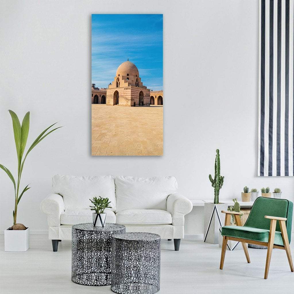 Ibn Tulun Mosque Courtyard Vertical Canvas Wall Art in beige and blue, single vertical panel hung on a wall