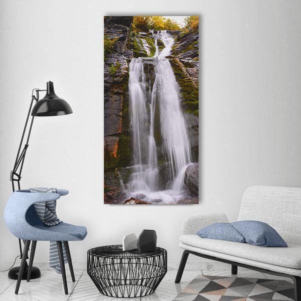 Moss Waterfall in Australia Vertical Canvas Wall Art in white, gray and green, single vertical panel hung on a wall