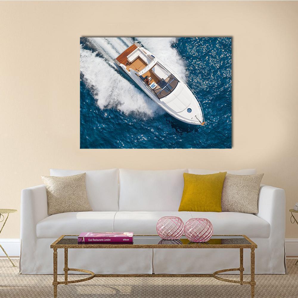Motor Yacht Aerial View Canvas Wall Art in white and blue, single panel hung on a wall