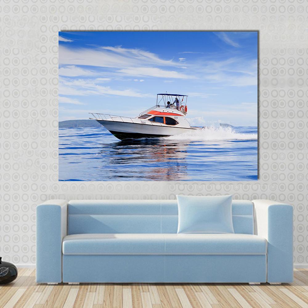 Motorboat in Ocean Canvas Wall Art in white and blue, single panel hung on a wall